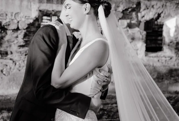 Black and white wedding kiss portrait